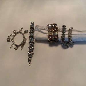 Four Silver and Crystal Bracelets and One Bronze and Crystal Bracelet